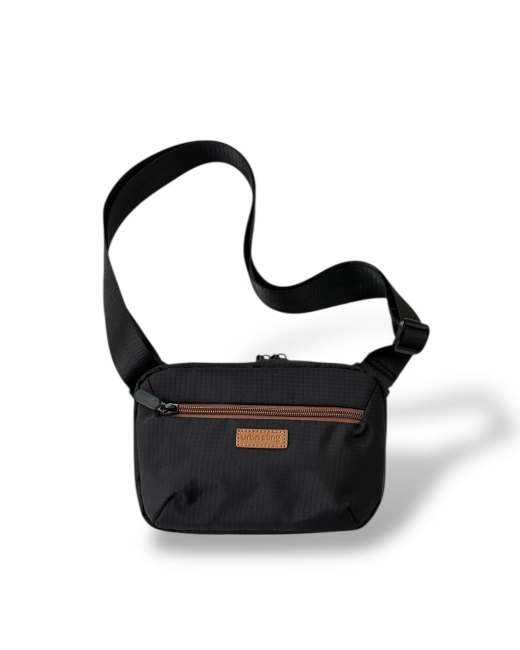 Everyday Sling cross body bag in black textured fabric with strap