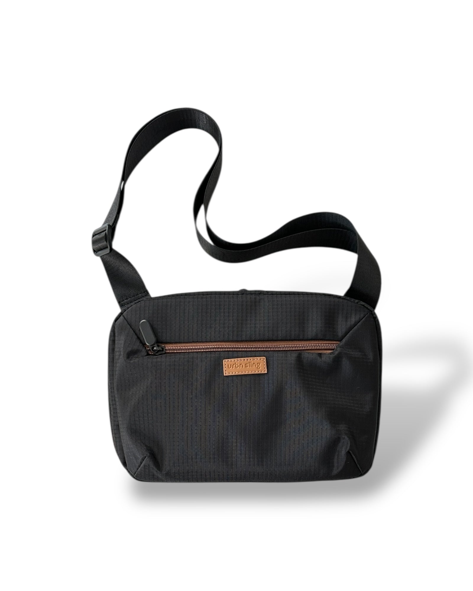 Go Beyond large sling bag in black textured fabric with strap