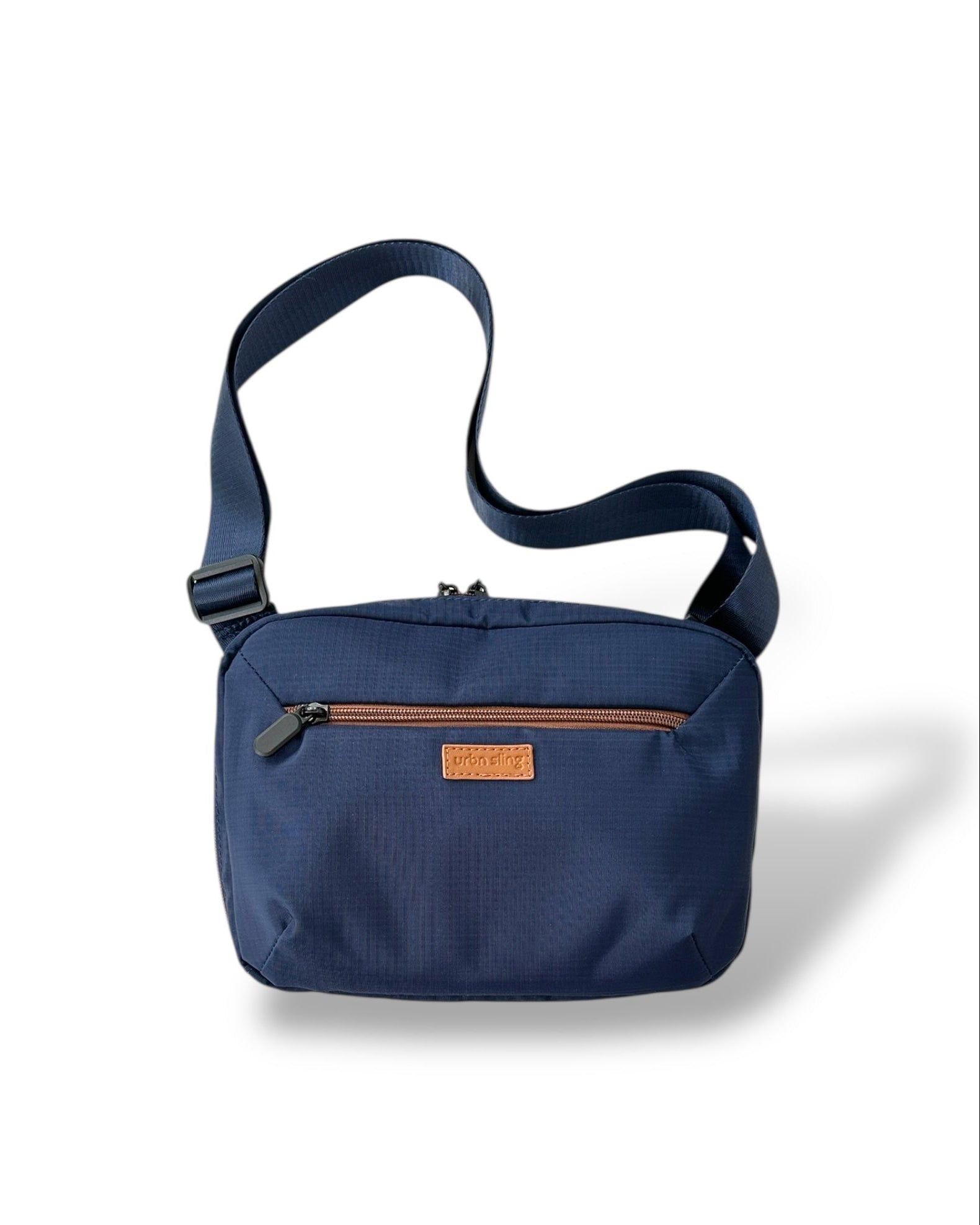 Go Beyond large sling bag in navy blue textured fabric with strap